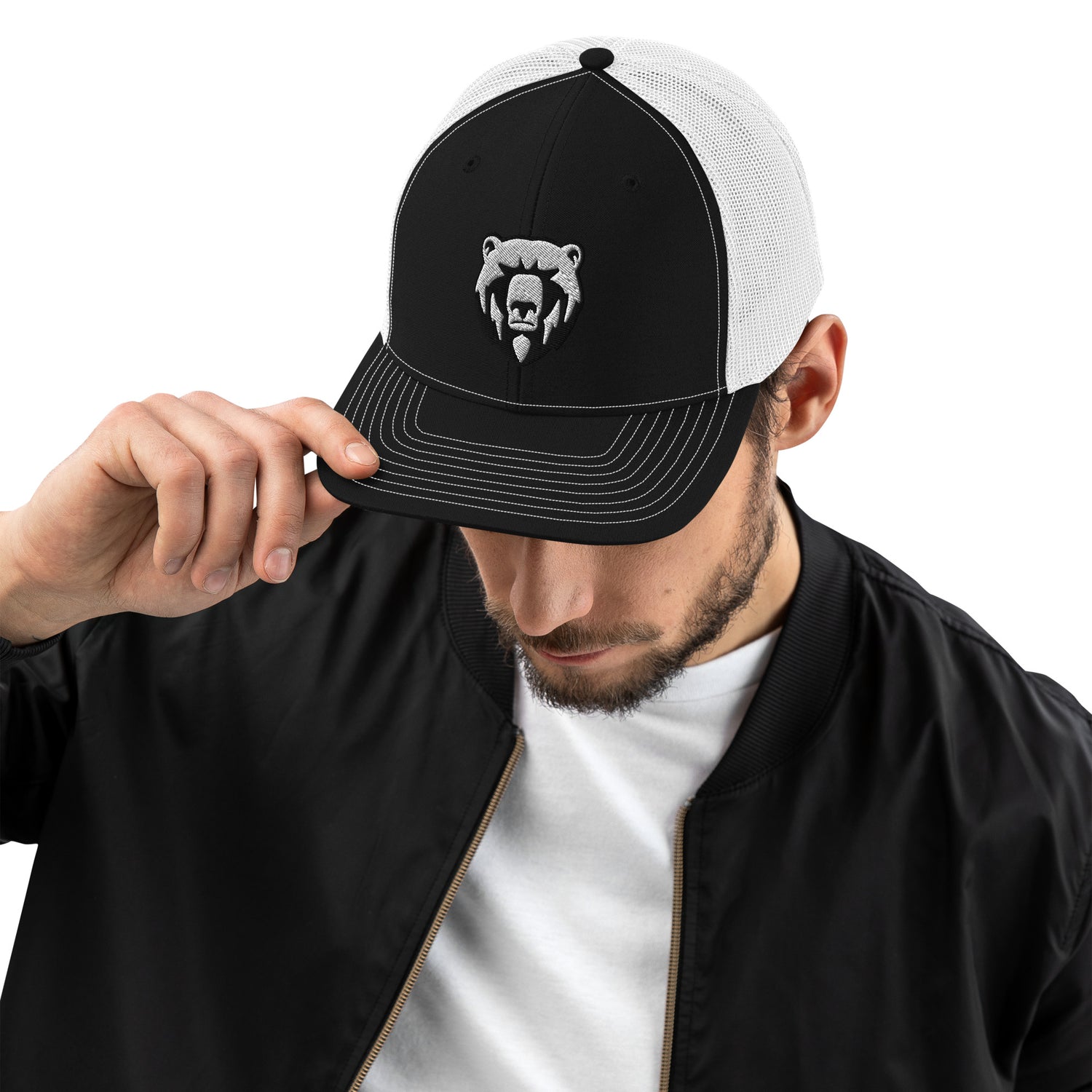 Man in a snap back trucker hat with bear logo